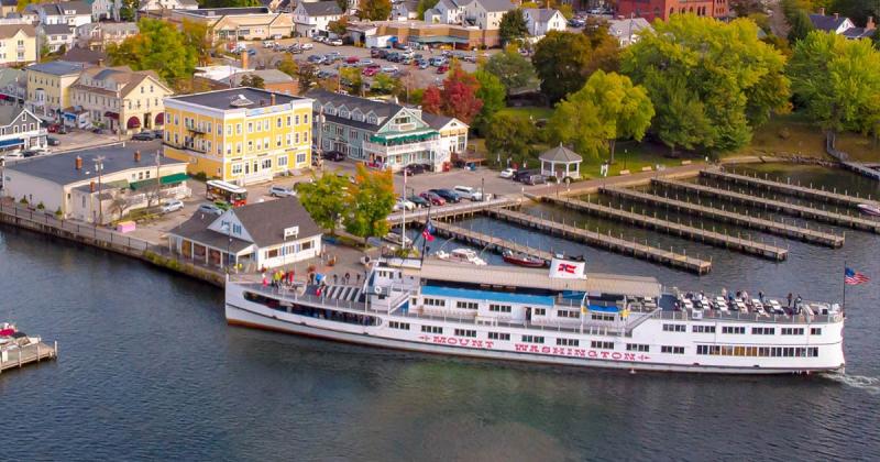 The M/S Mount Washington approaches the city dock in Wolfeboro. If you look closely, you'll spot The Molly Trolley ready to pick up passengers.
