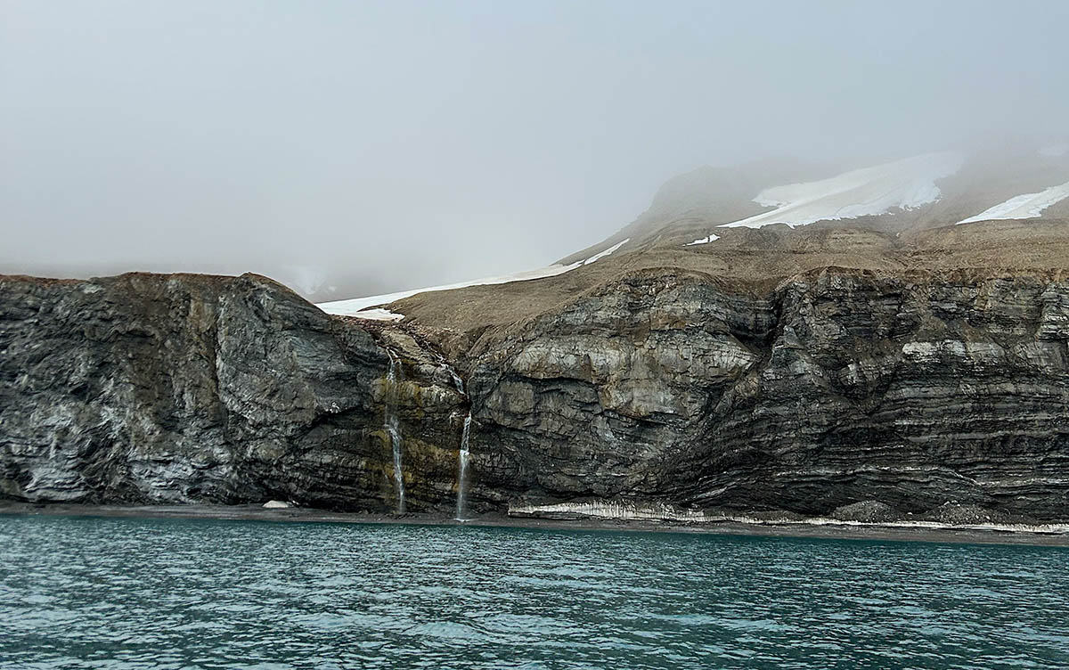 Adventure Canada_The fog lifts above a Bylot Island waterfall
