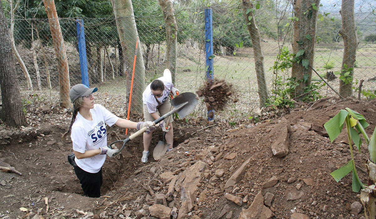 Lauren volunteering digging latrines_via Facebook